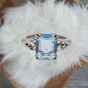 Avon Signed Silver Tone Ring with Square Blue Gemstone. Size 6